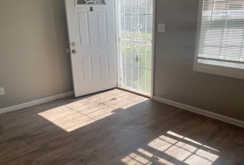 Entrance foyer featuring dark wood-type flooring
