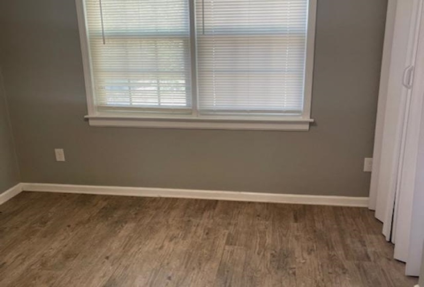 Spare room featuring hardwood / wood-style floors