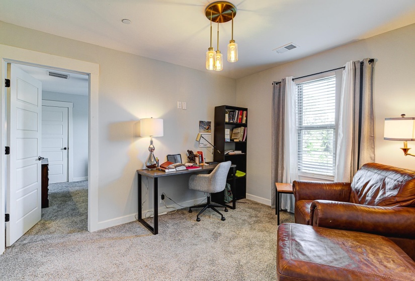 Office space featuring light carpet
