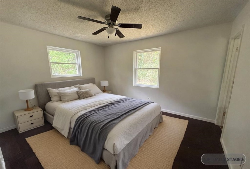 Bedroom featuring a textured ceiling and ceiling fan