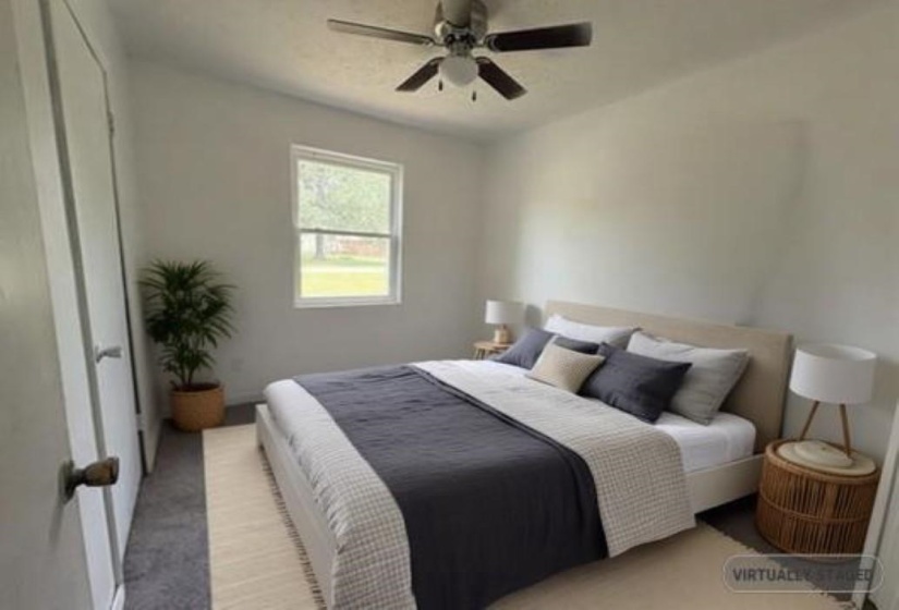 Bedroom with carpet and ceiling fan