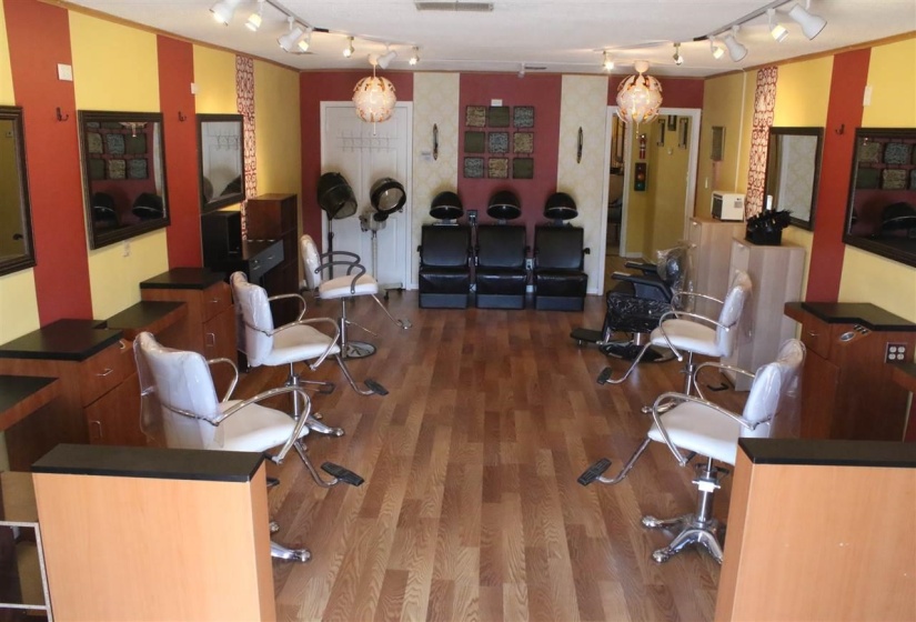 Interior space featuring track lighting and hardwood / wood-style floors