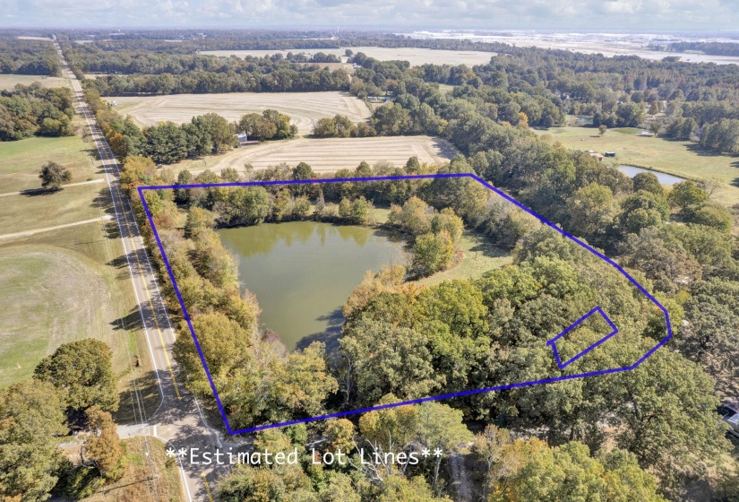 Aerial view featuring a water view and a rural view