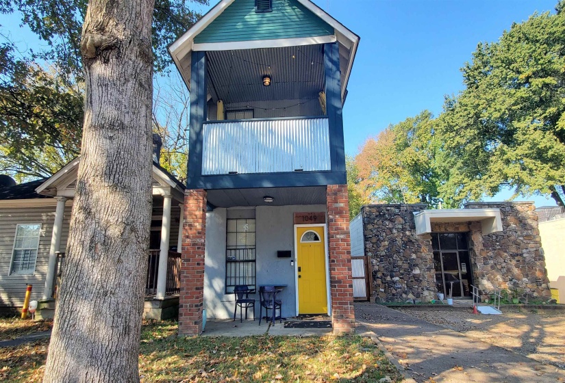View of front of house with a balcony