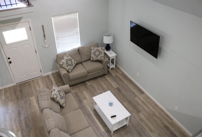 Living room with hardwood / wood-style floors and plenty of natural light