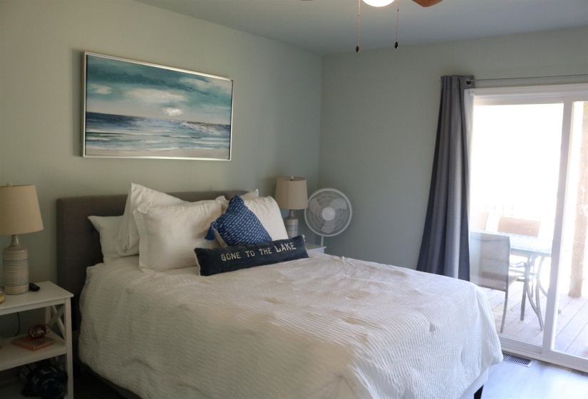 Bedroom featuring ceiling fan and access to outside