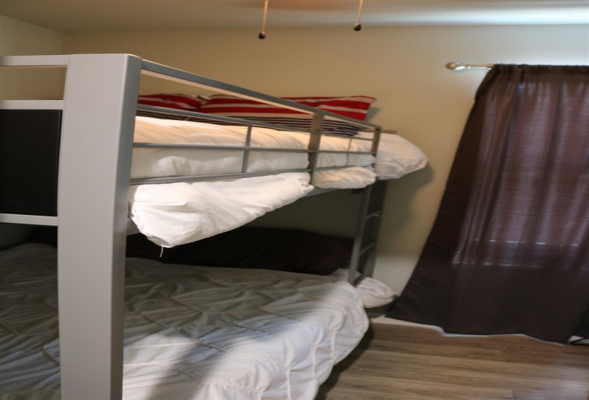 Bedroom with hardwood / wood-style floors