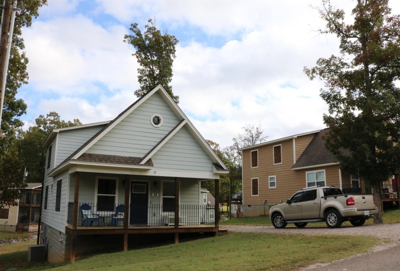 View of front of property with a front lawn and a porch