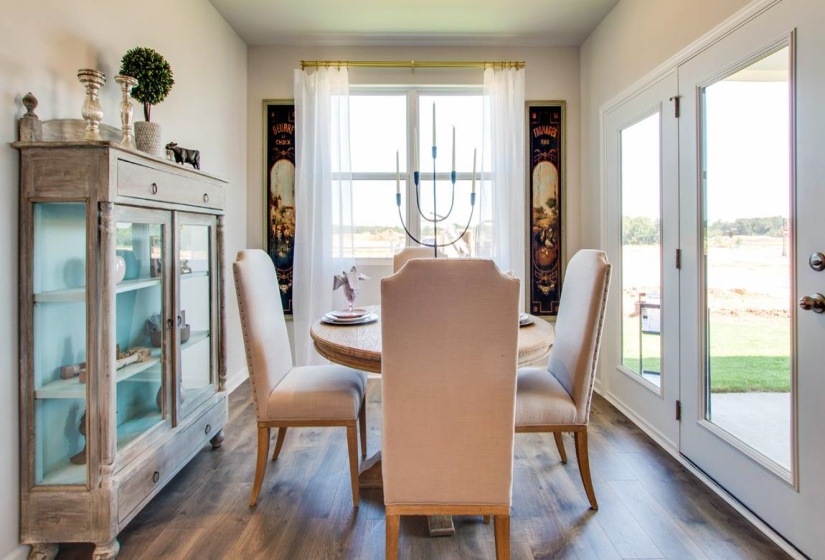 Dining area featuring dark wood-type flooring