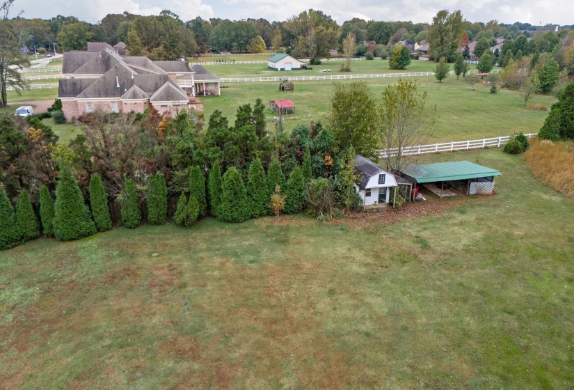 Birds eye view of property with a rural view