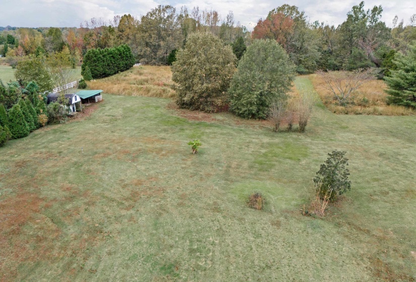 Birds eye view of property with a rural view