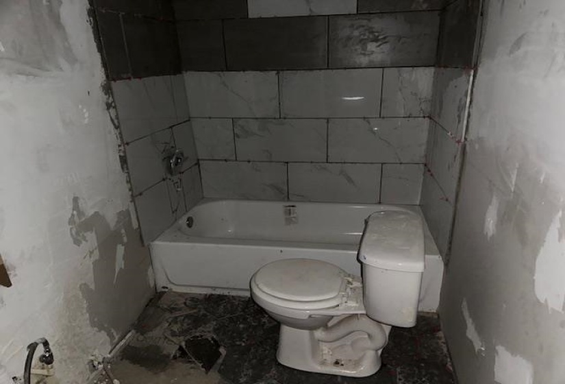 Bathroom featuring a bathtub and toilet