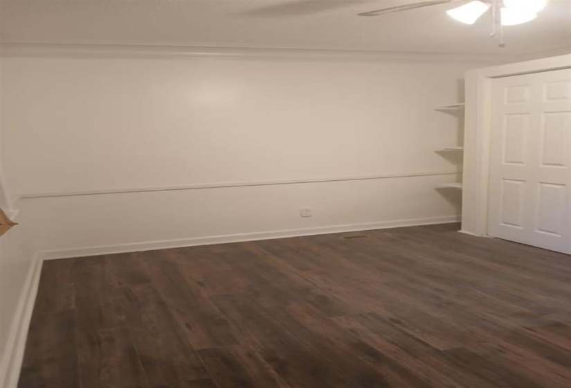 Interior space featuring dark hardwood / wood-style floors and ceiling fan
