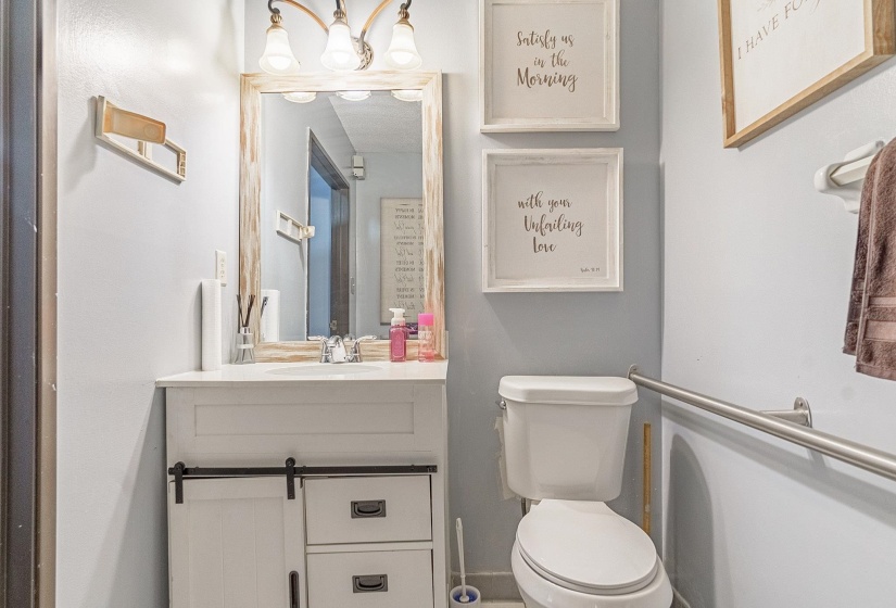 Bathroom featuring vanity and toilet