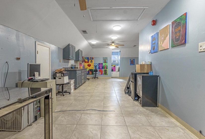 Playroom featuring light tile patterned floors and ceiling fan