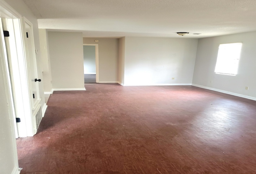 Empty room featuring dark hardwood / wood-style floors