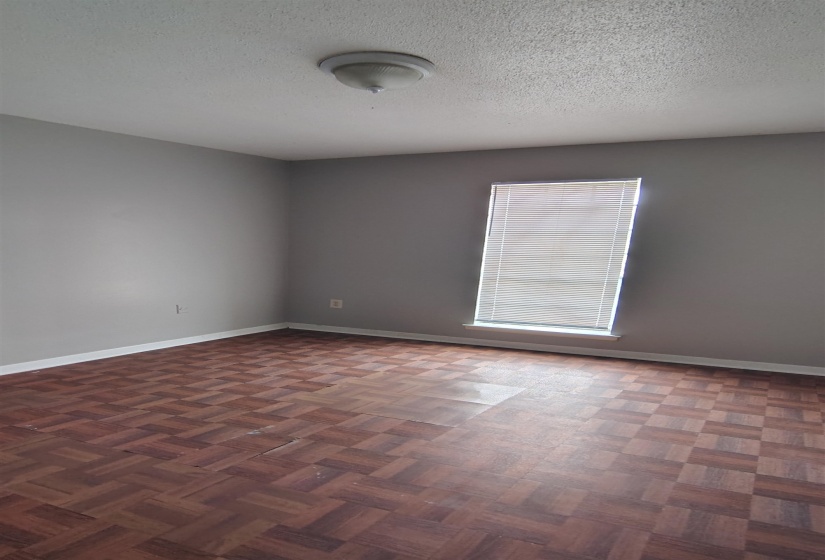 Unfurnished room with a textured ceiling