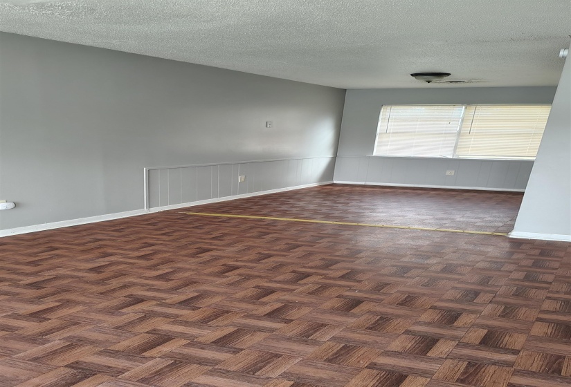 Empty room featuring a textured ceiling