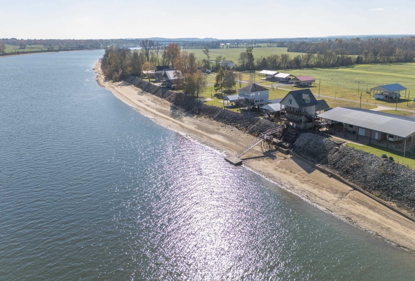 Aerial view featuring a water view and a view of the beach