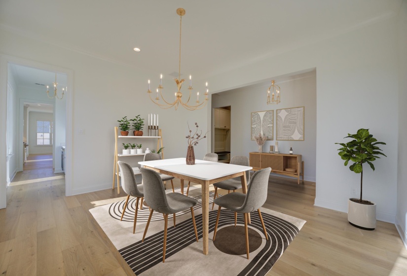 A large formal dining room featuring elegant hardwood floors and soft, neutral walls, creating a sophisticated and inviting atmosphere. The space is perfect for hosting gatherings or enjoying intimate meals in a timeless setting.
