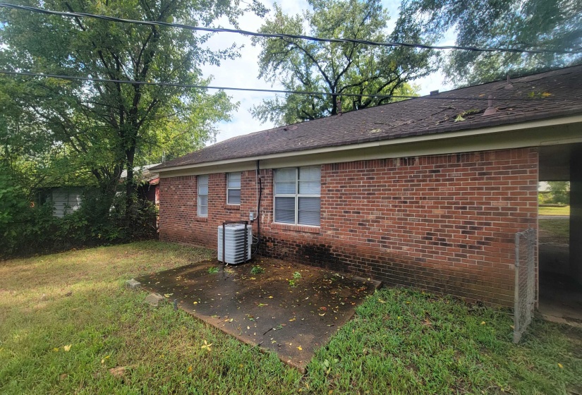 View of home's exterior featuring central air condition unit, a yard, and a patio