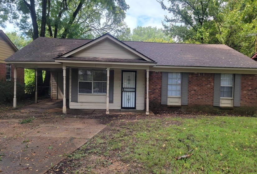 View of front of property with a carport