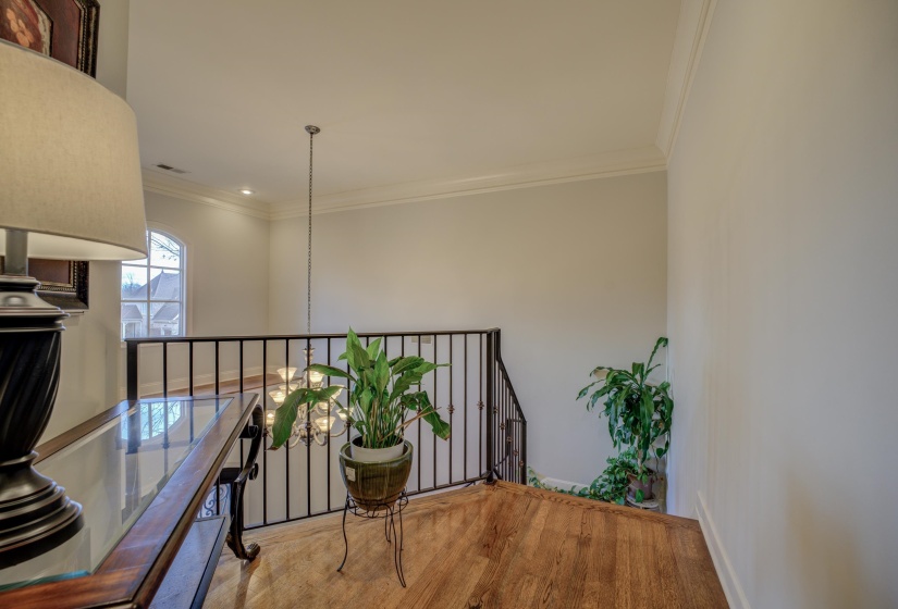 These lead to the 2 upstairs bedrooms, attic, full bath, bonus room and office.