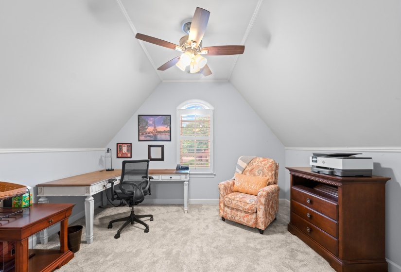 Office area featuring new carpet floors, vaulted ceiling, and a ceiling fan