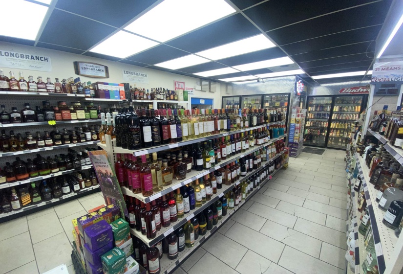Misc room with tile patterned floors and a drop ceiling