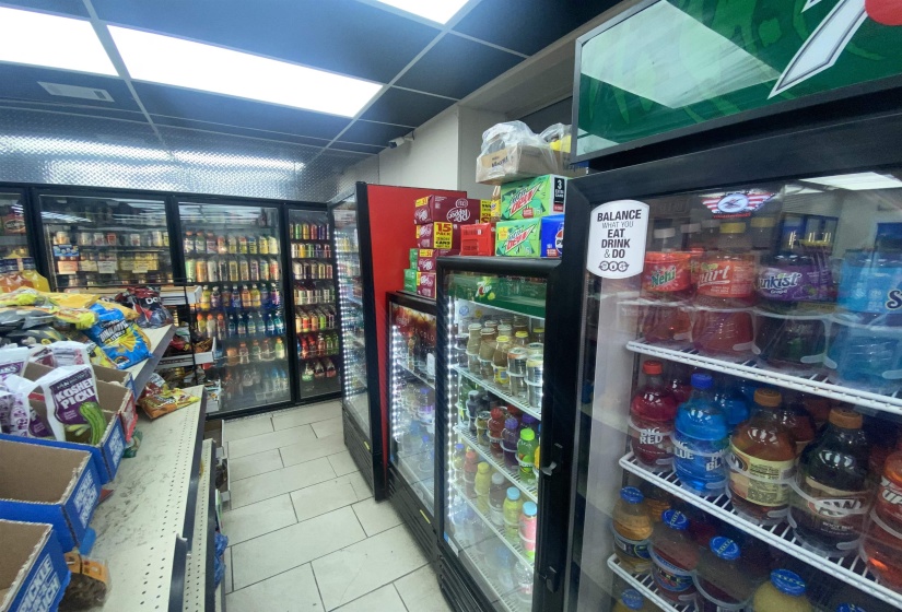 Miscellaneous room with tile patterned floors and a drop ceiling