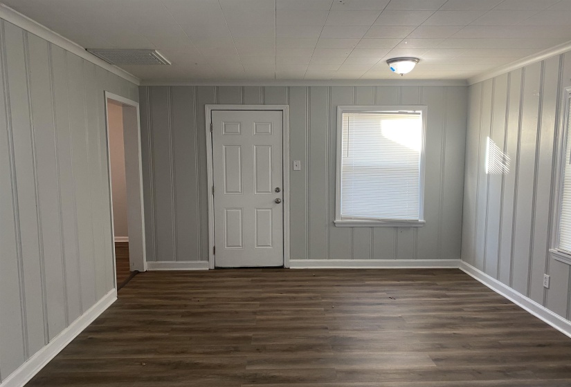 Unfurnished room with dark hardwood / wood-style floors