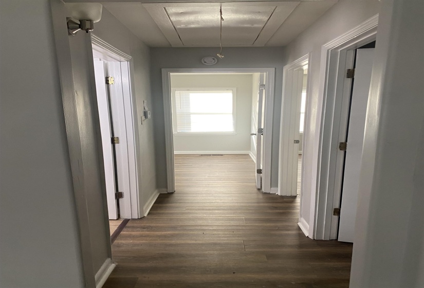 Hallway featuring dark hardwood / wood-style flooring