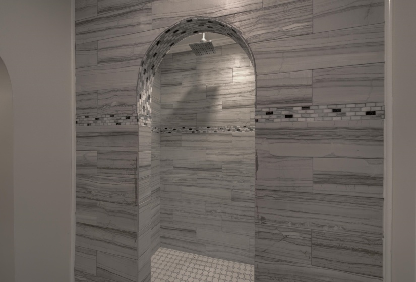 Bathroom featuring a tile shower