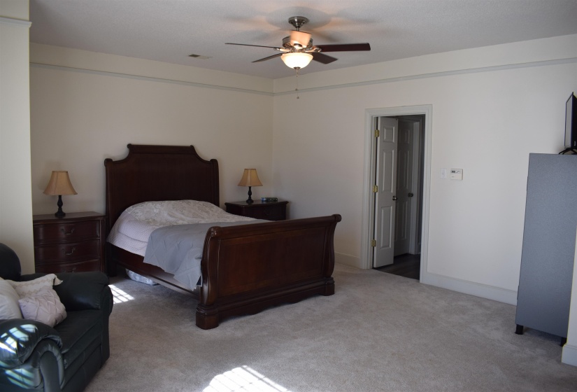 Bedroom featuring carpet floors and ceiling fan