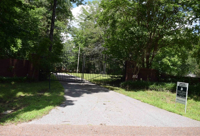 View of road featuring a gate