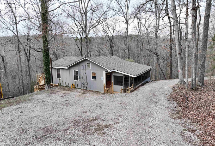 View of front of home with a sunroom