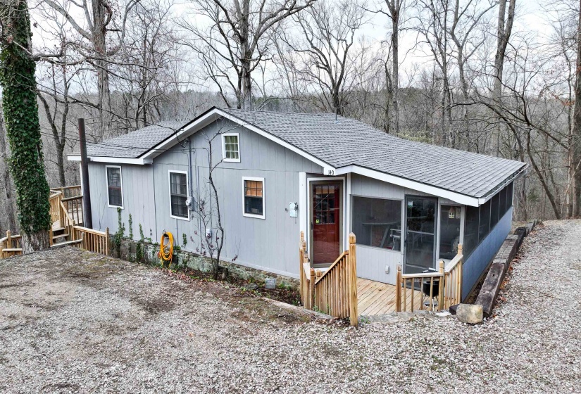 View of front of home featuring a sunroom
