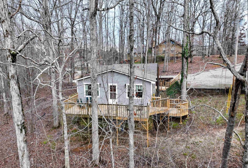 Rear view of property featuring a deck