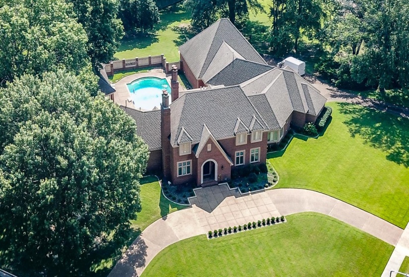 View of subject property featuring a pool