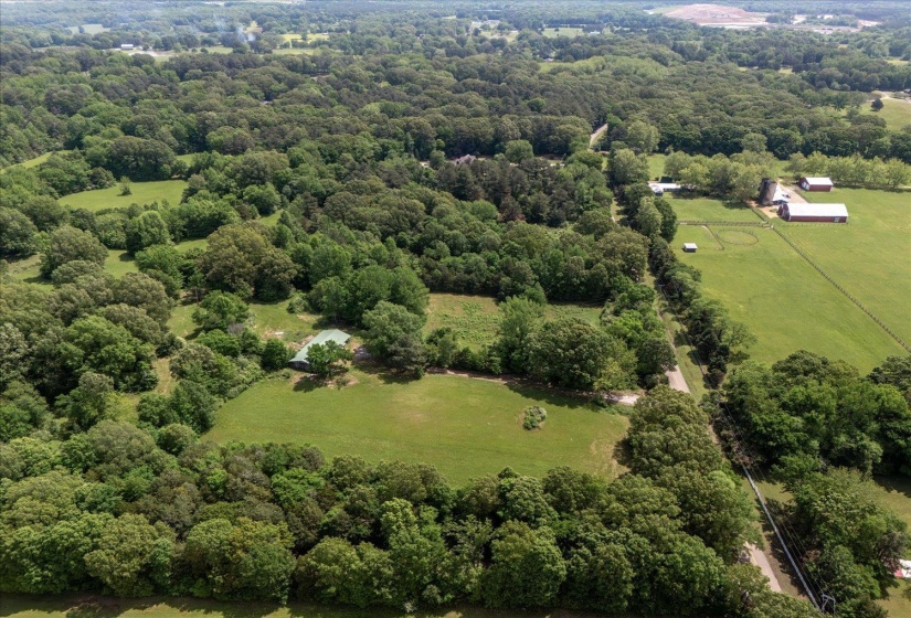 Drone / aerial view featuring a rural view and a view of trees