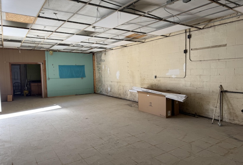 18 ft x 35 ft. celings are a little over 9 ft. New drop-down tiles are in building and just need to be installed.