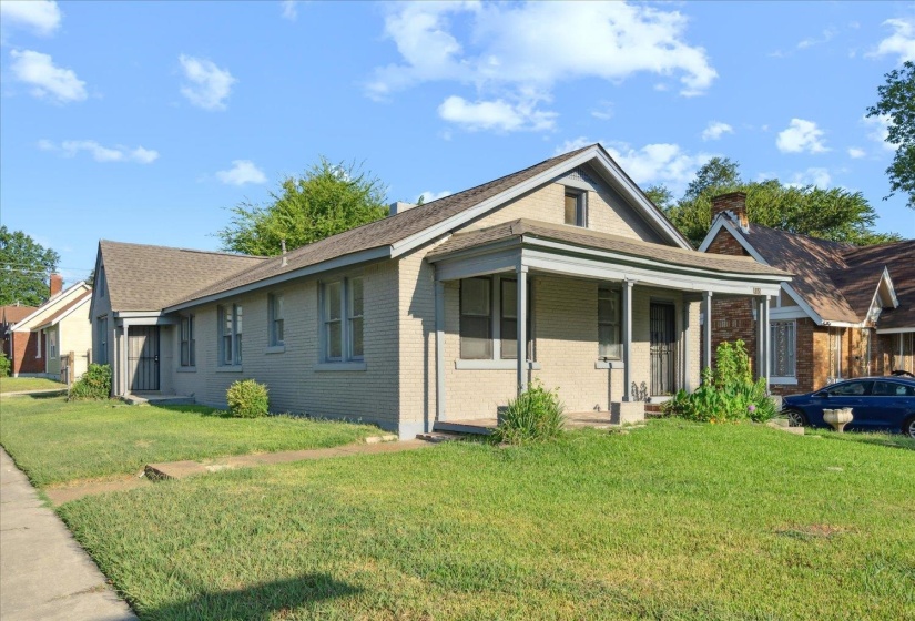 View of front of house with a front lawn and covered porch