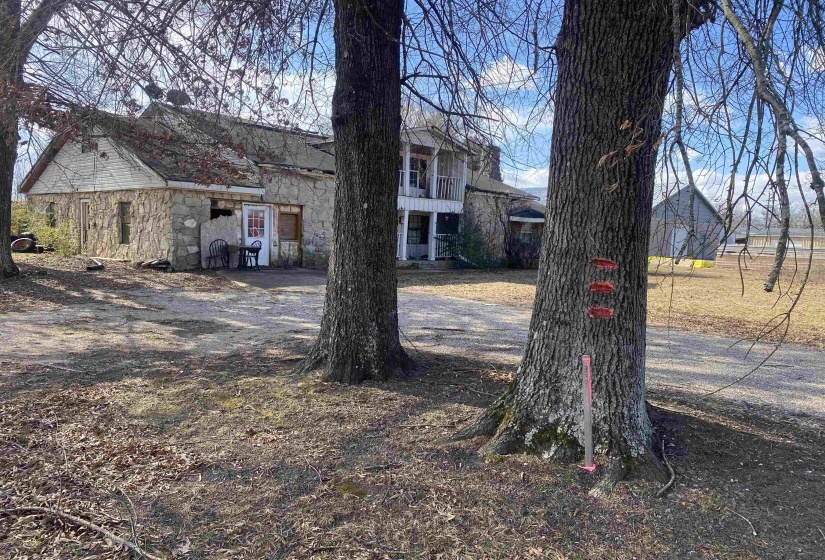 View of yard with a balcony