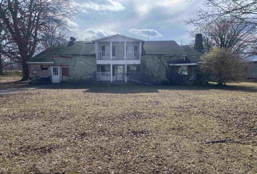Back of house featuring a balcony