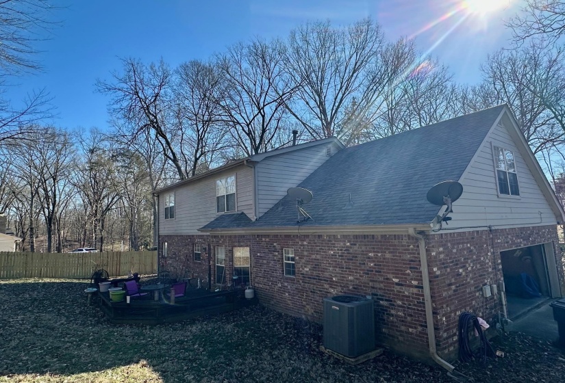 Back of house with central air condition unit and a wooden deck