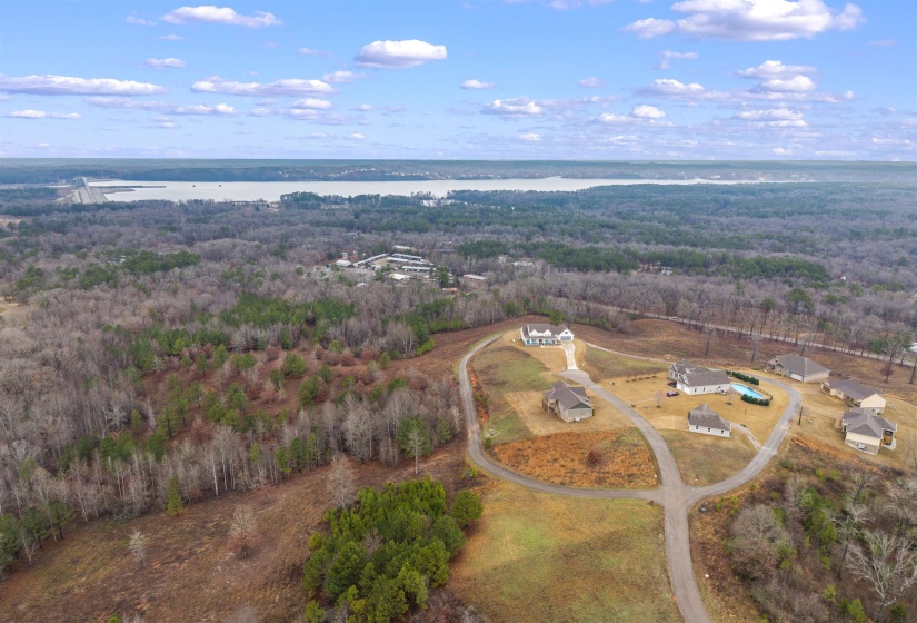 View of property location featuring a forest and a large body of water