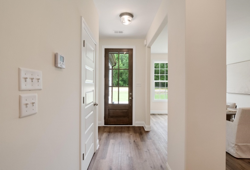Entryway with hardwood / wood-style flooring