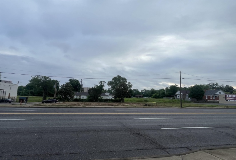 View of asphalt street with sidewalks and curbs