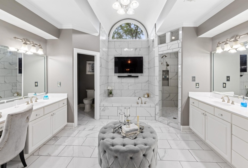 Full bathroom featuring independent shower and bath, vanity, crown molding, and toilet