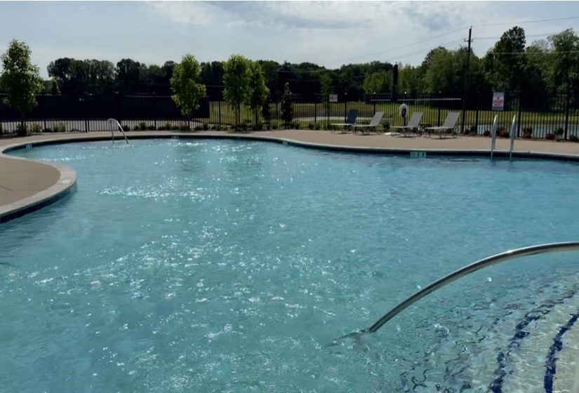 Community pool with a patio area